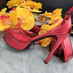 Red high heels with platform. New but used it once for photo shoot. Check photos
